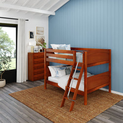 Wooden bunk bed with ladder in a modern blue-themed bedroom.