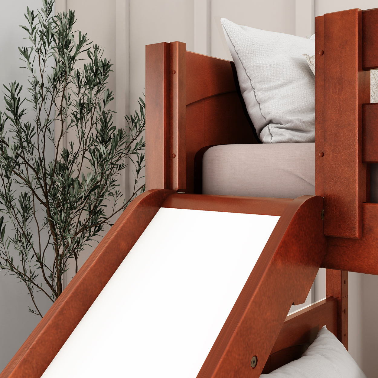 Wooden bunk bed with slide next to a potted plant in a modern bedroom setting.