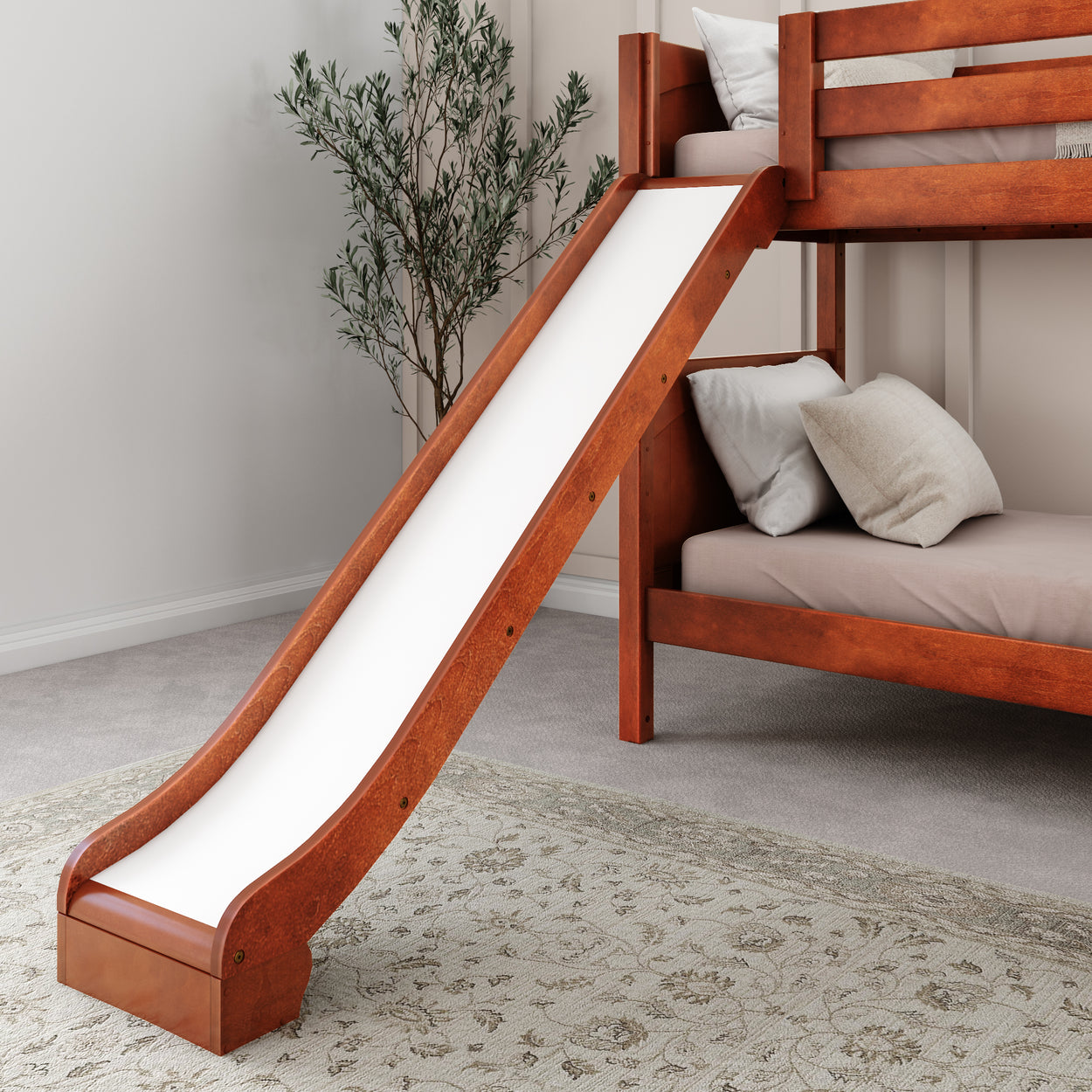 Bunk bed with slide and cozy bedding in modern kids' room.