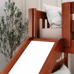 Wooden loft bed with slide and cozy cushions in a child-friendly room featuring decorative plants.