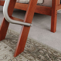 Wooden bunk bed ladder with metallic handrail on a carpeted floor with a decorative rug.