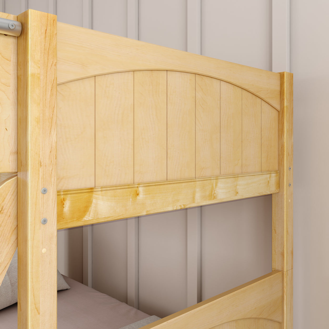 Wooden bunk bed frame with natural finish against a beige wall.