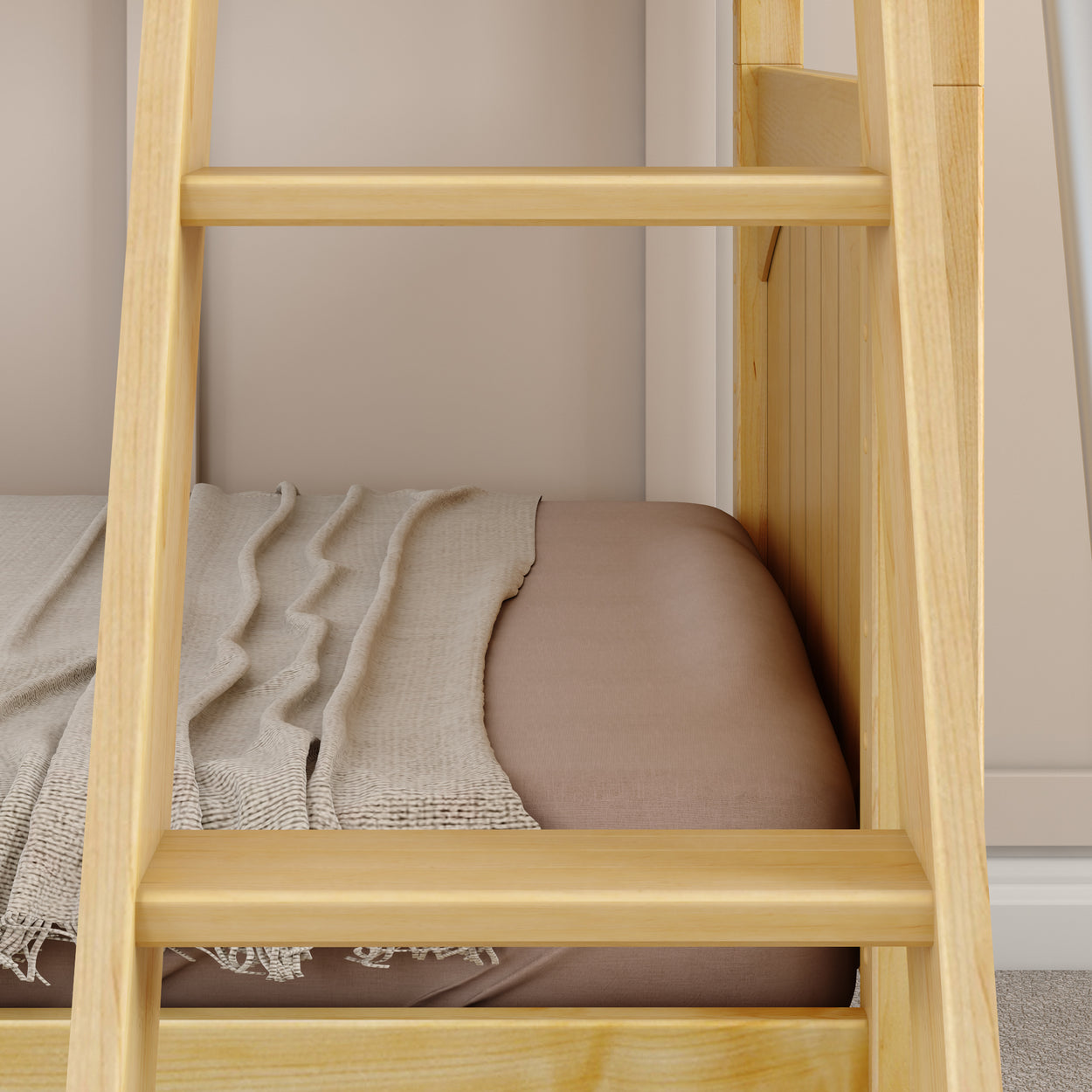 Wooden bunk bed ladder with beige bedding and cozy blanket in a modern bedroom setting.