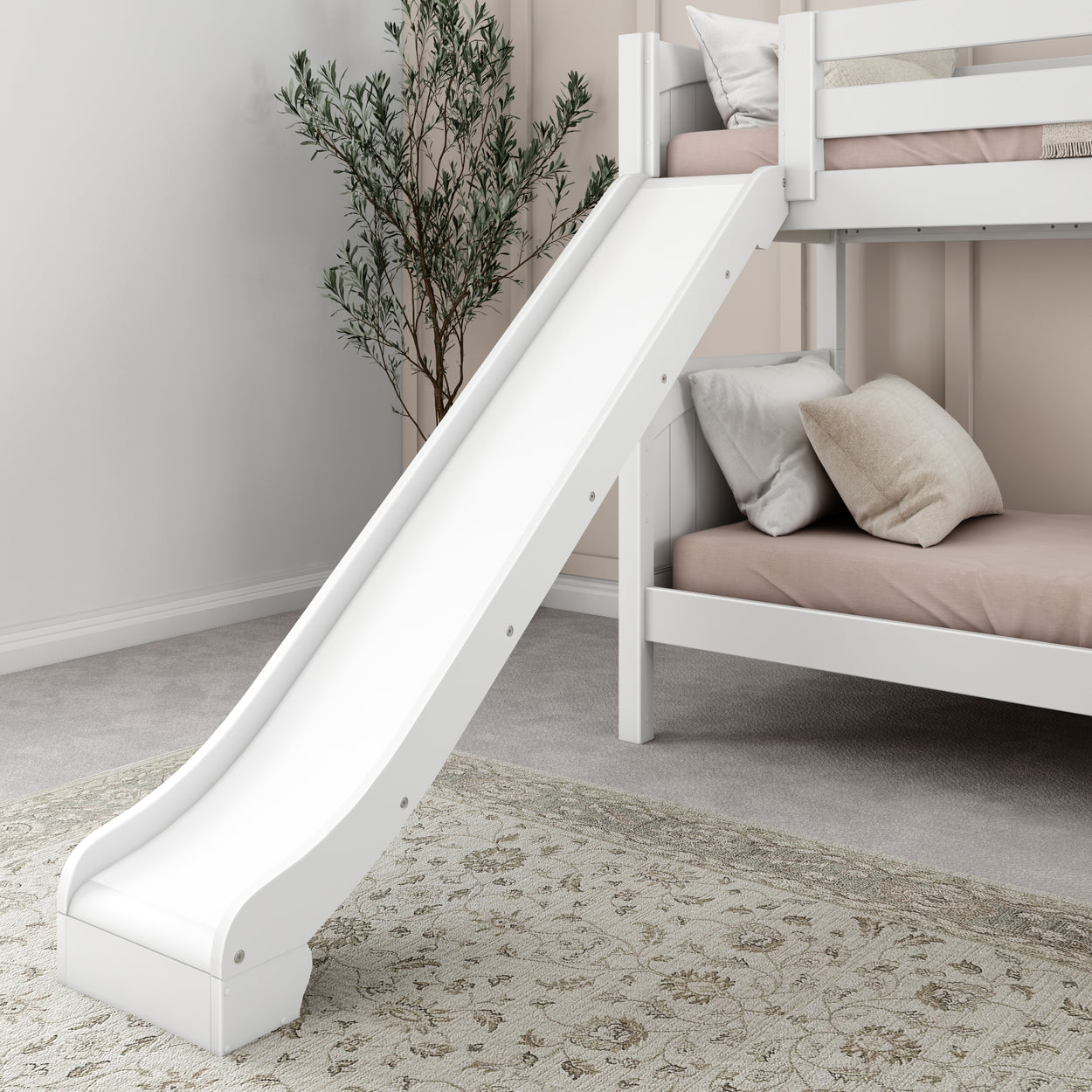 White bunk bed with slide and beige bedding in a modern children's bedroom with decorative plant.
