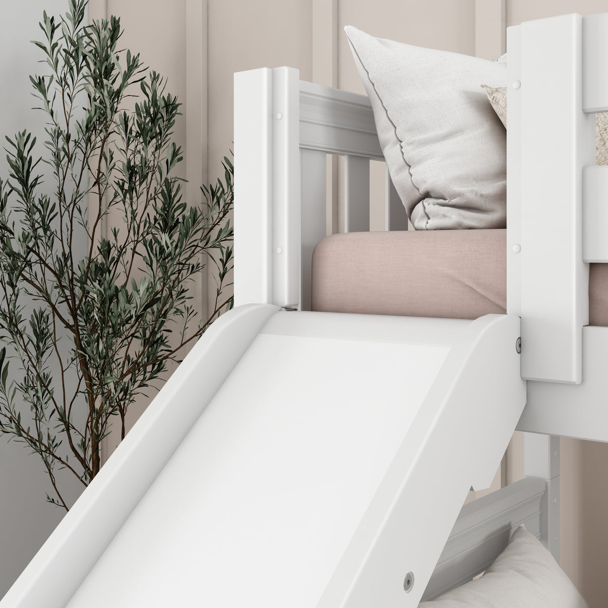 White children's loft bed with slide and cozy pillows, perfect for modern kids' room design.