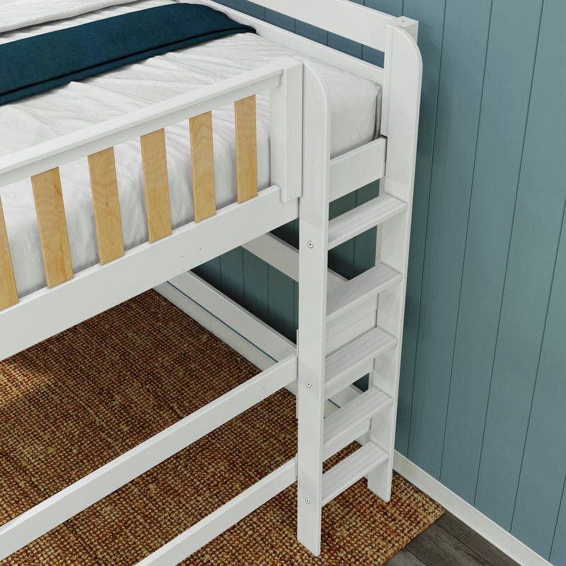 White wooden bunk bed ladder and safety guardrail with natural wood slats, white mattress, teal paneled wall and brown textured rug