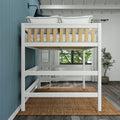 White wooden loft bunk bed with ladder and twin mattress in modern coastal bedroom featuring blue shiplap wall, woven rug, potted plant and window light