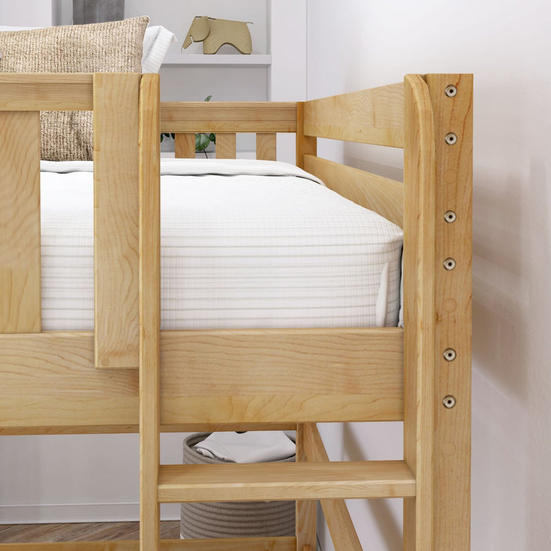 Light natural wood bunk bed for kids with safety guardrail, white mattress and bedding, woven accent pillow and under-bed storage basket in modern bedroom