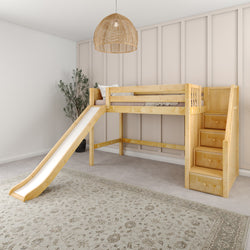 Wooden loft bed with slide and staircase in children's bedroom featuring wall paneling and woven pendant light.