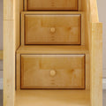 Light maple staircase with built-in storage drawers and round wooden knobs, custom stair-storage cabinetry