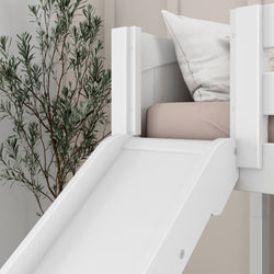 White children's loft bed with slide and beige bedding, next to a houseplant, in a modern bedroom setting.