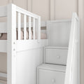 White wooden kids loft bunk bed with built-in staircase storage drawers and safety railing against a neutral beige nursery wall