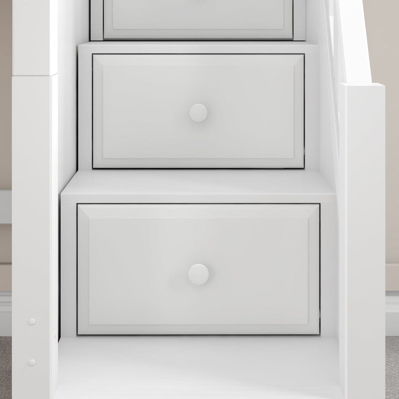 Modern white built-in under-stair storage drawers with recessed panel fronts and round knobs