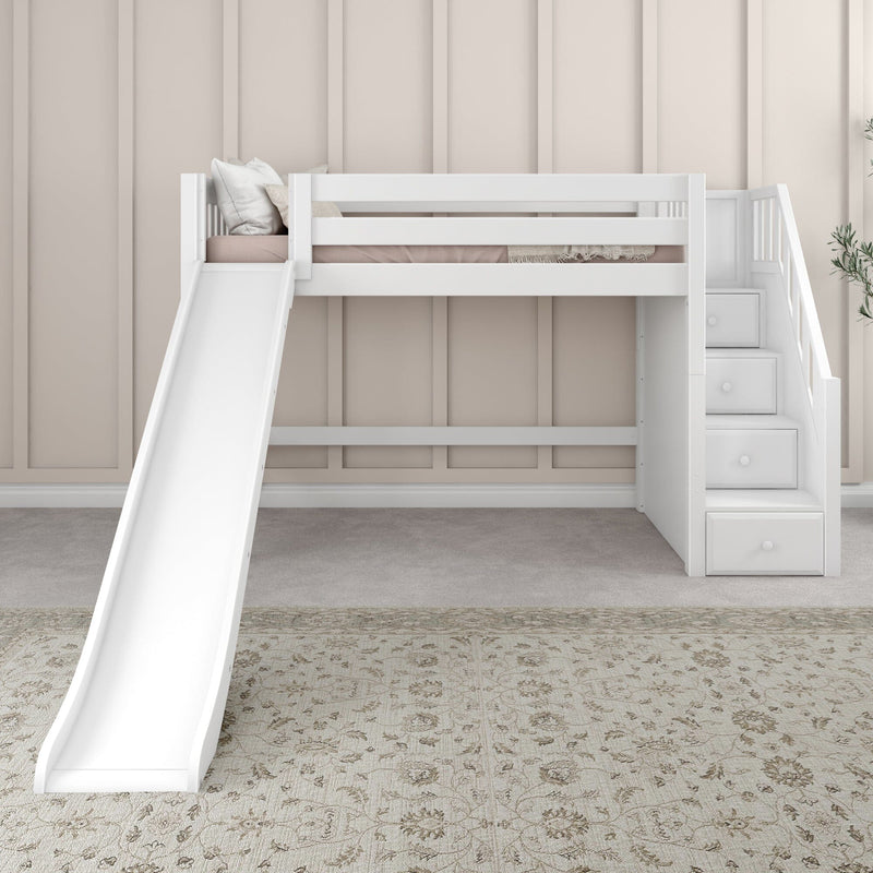 White loft bed with slide and built-in staircase drawers against beige paneled wall in modern kids' bedroom with pillows and patterned rug