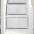 Close-up of white wooden dresser drawers with round knobs, modern minimalist bedroom storage solution