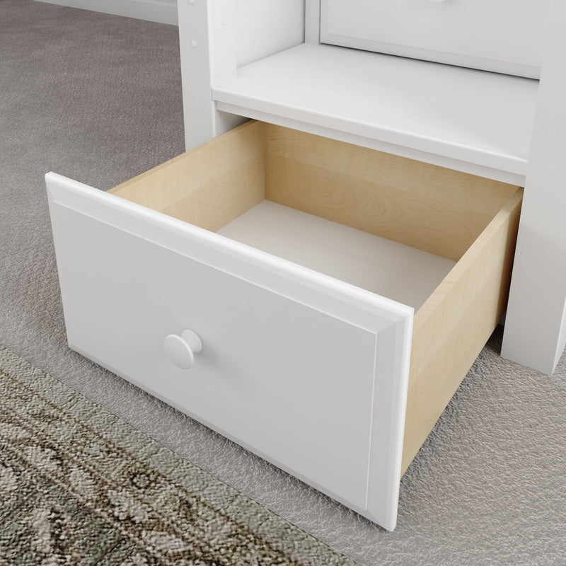 Open white dresser drawer with light maple interior and round knob on gray carpet, modern bedroom storage