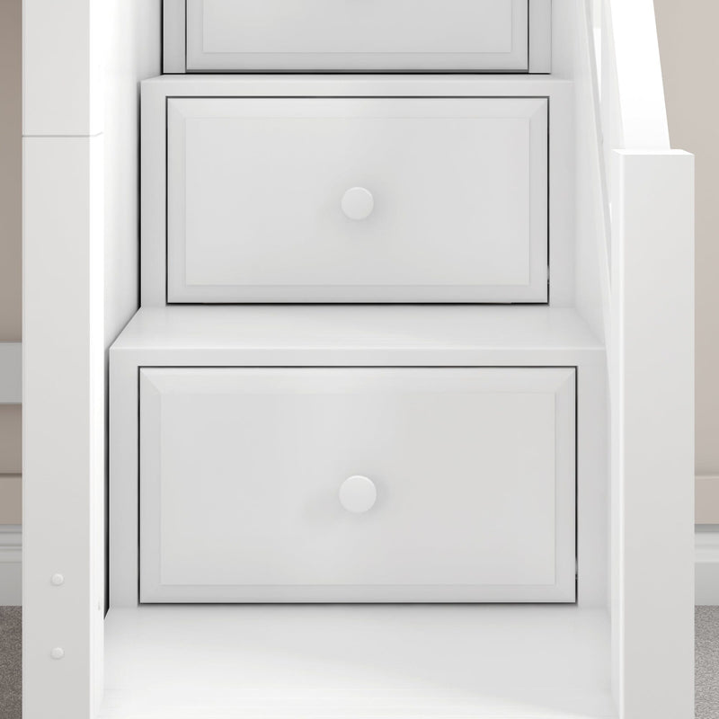 Close-up of white painted dresser drawers with round knobs in modern built-in bedroom storage