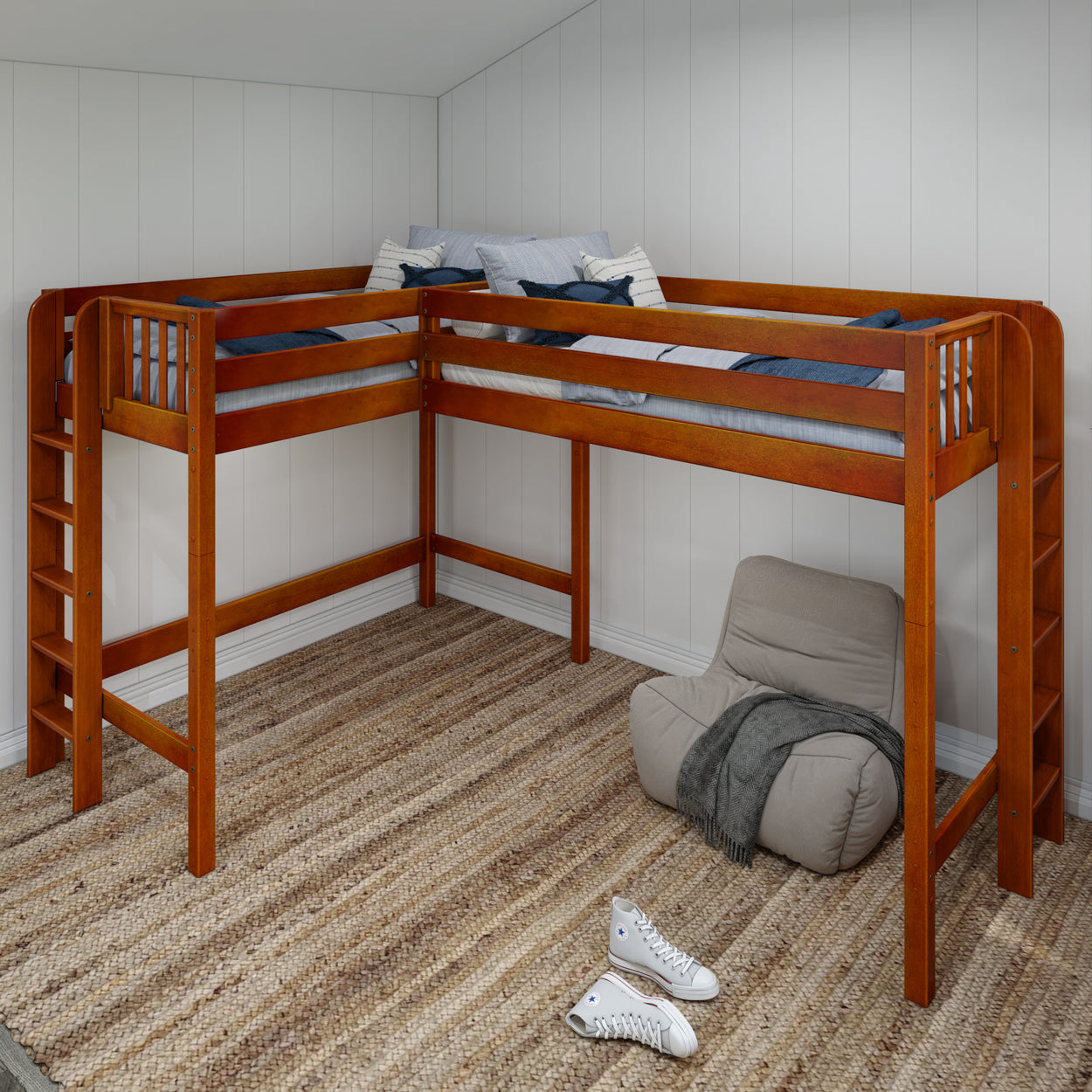 L-shaped wooden loft bed frame with ladder in a cozy room setting featuring a plush chair, striped rug, and casual white sneakers.