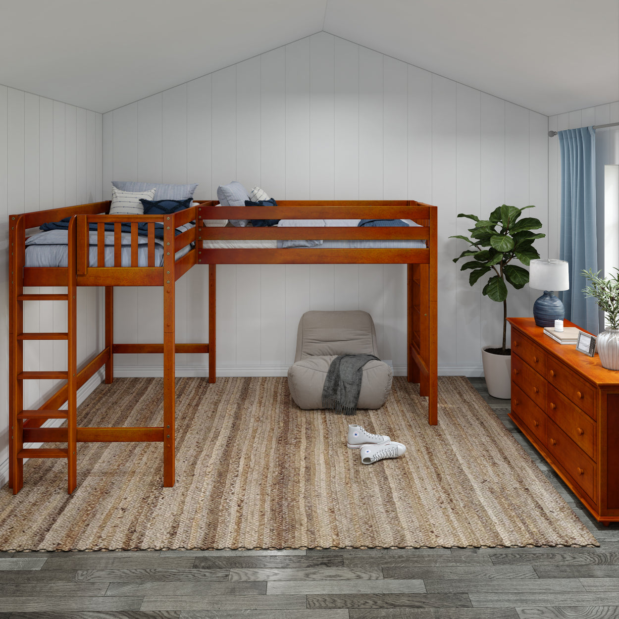 Loft bedroom with wooden bunk bed, cozy seating, and a woven rug in a bright, modern design.