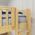 Close-up of a solid pine bunk bed with safety rails and ladder in a light wood finish, gray bedding and white shiplap wall