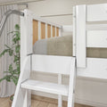 Close-up of white wooden bunk bed ladder and safety guardrail with built-in steps, neutral beige bedding and potted plant in a modern kids' bedroom