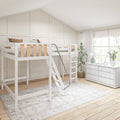 Bright neutral children's bedroom with white loft bunk bed and wood slats, paneled vaulted wall, white dresser, potted plants and large window letting in natural light