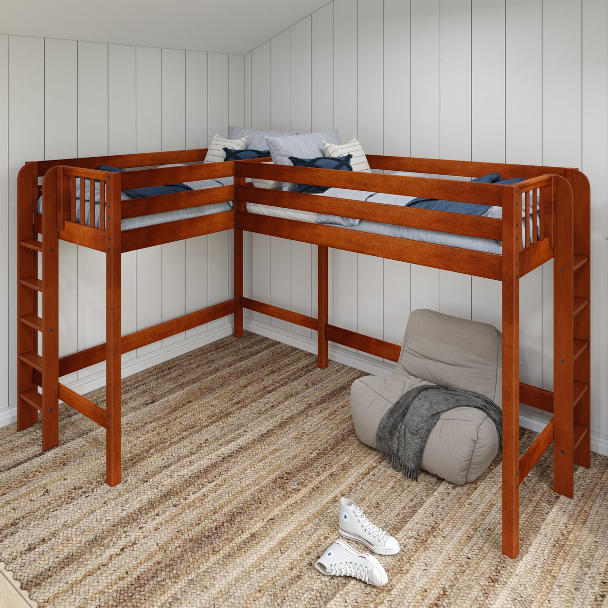 Wooden corner bunk bed with ladder in cozy bedroom featuring striped carpet, casual chair, and white sneakers.