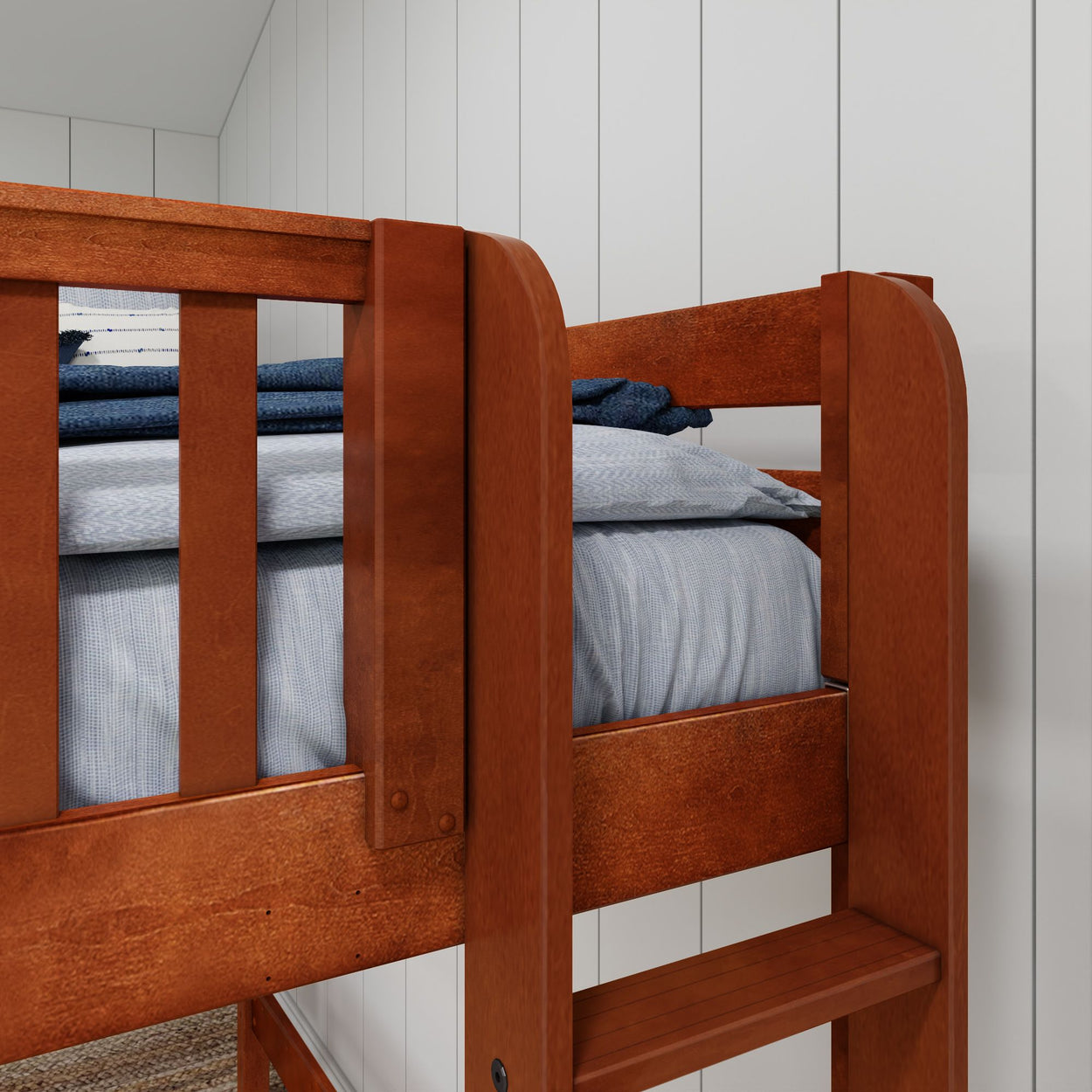 Wooden bunk bed with blue bedding in a modern bedroom setting.