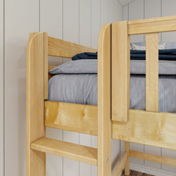 Wooden bunk bed with blue bedding in a modern bedroom setting.