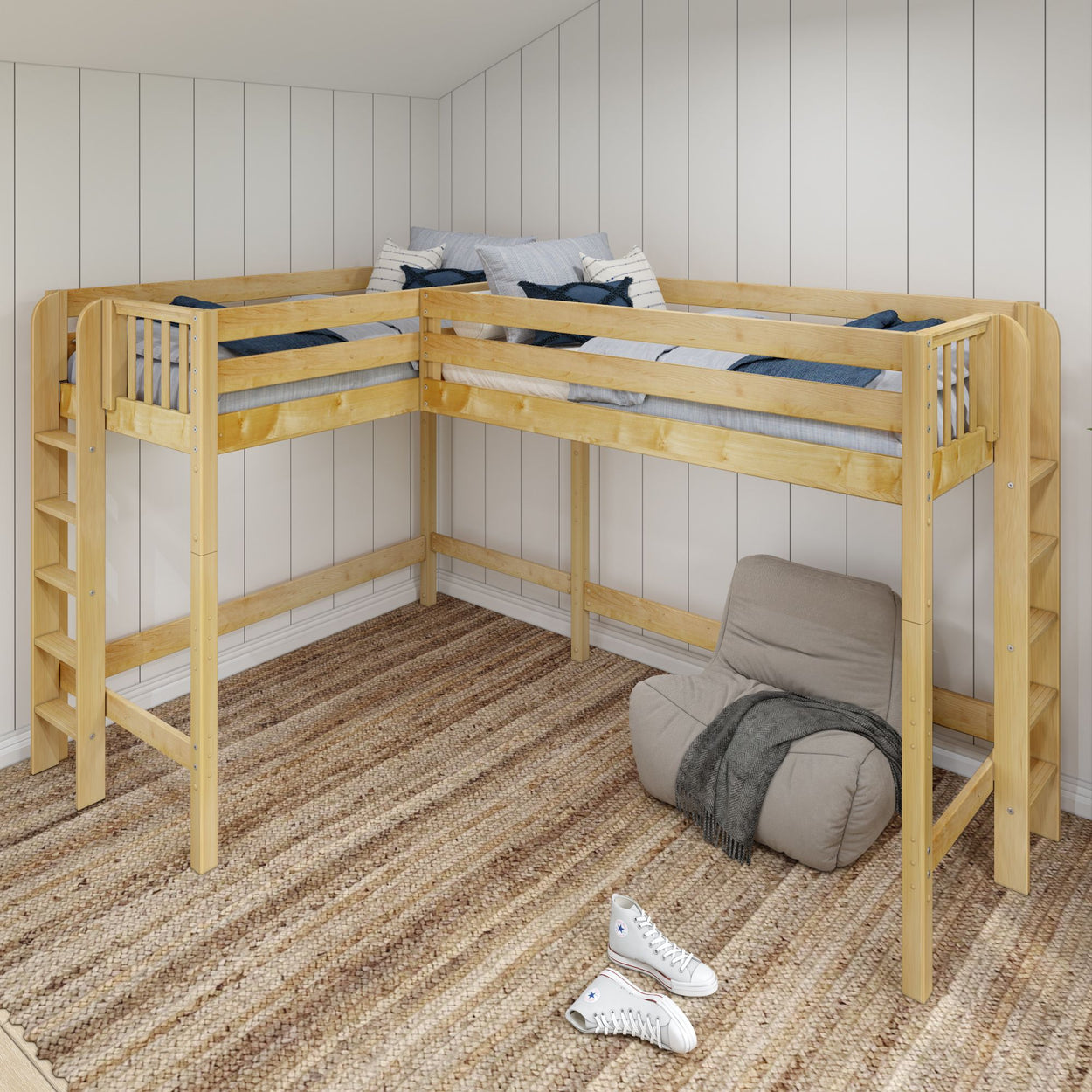 Wooden corner loft bed in cozy bedroom with beige armchair and striped rug.