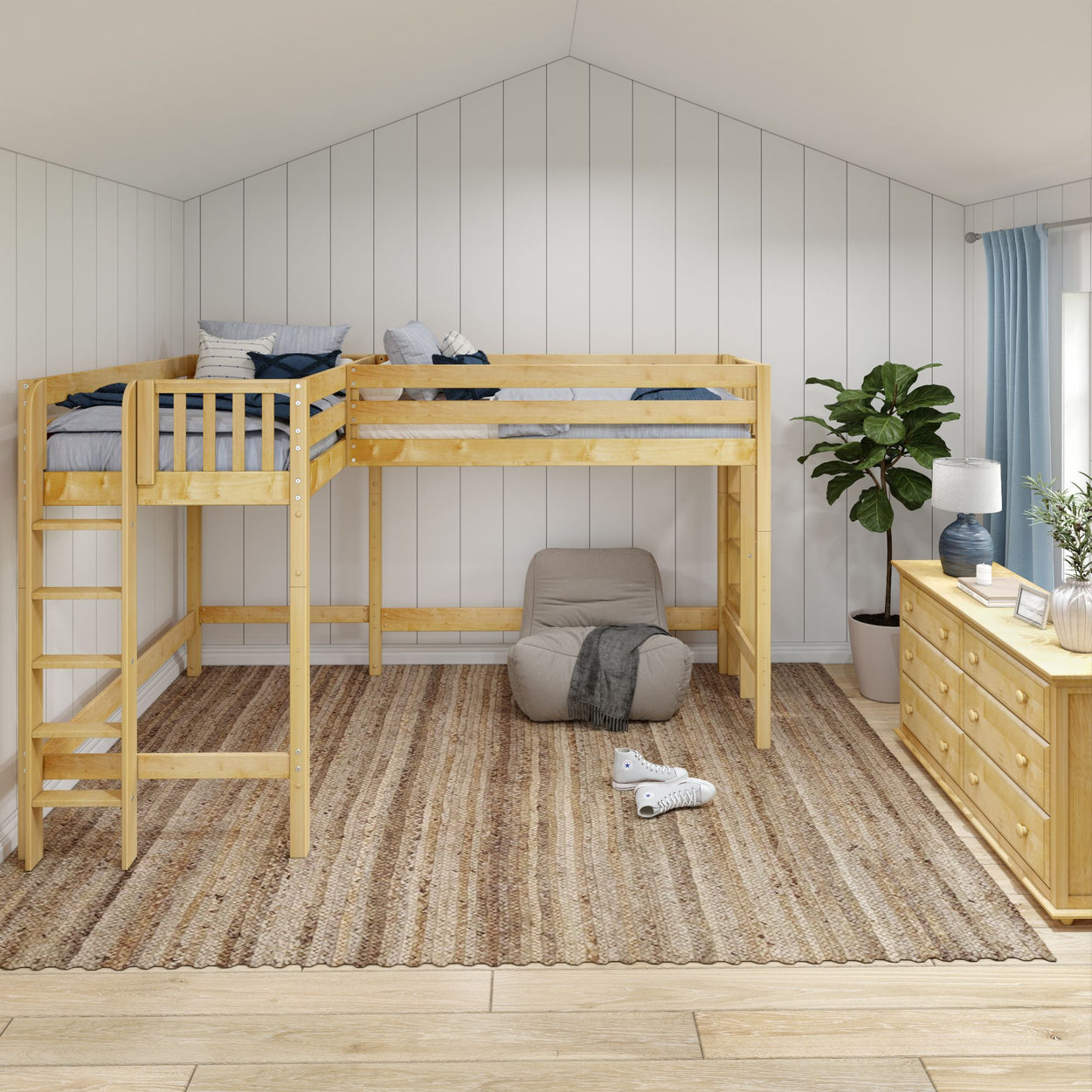 Cozy bedroom featuring a wooden loft bed with a ladder, beige chair, indoor plant, and blue curtains on a striped rug.