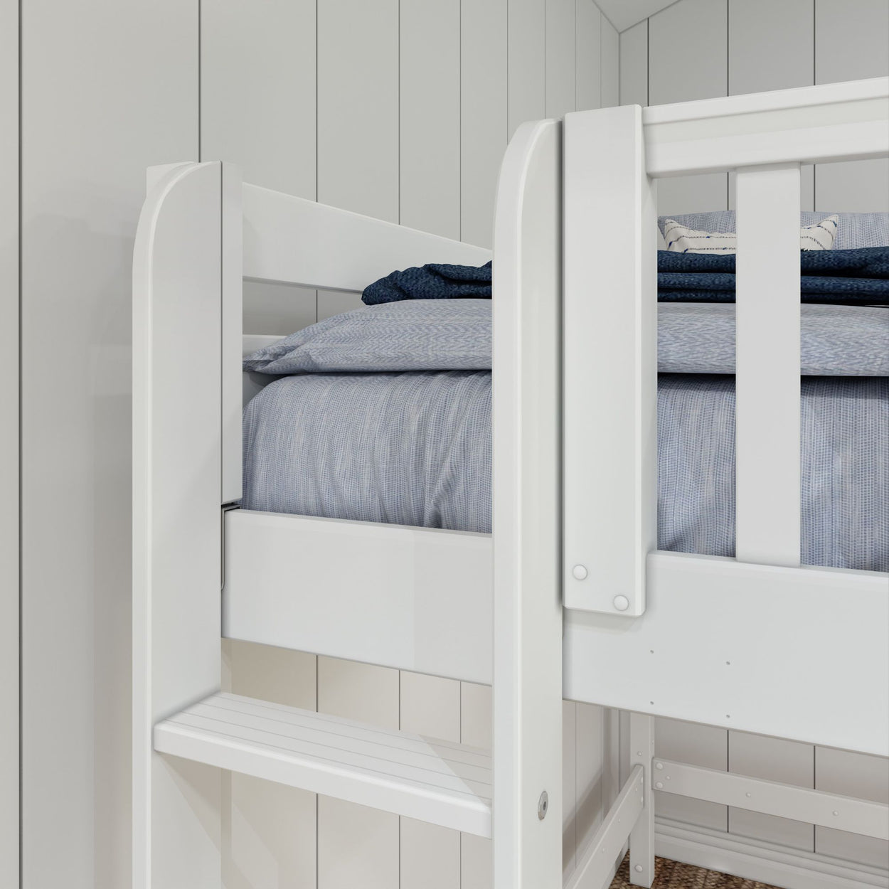 White wooden bunk bed with blue bedding in a modern bedroom setting.