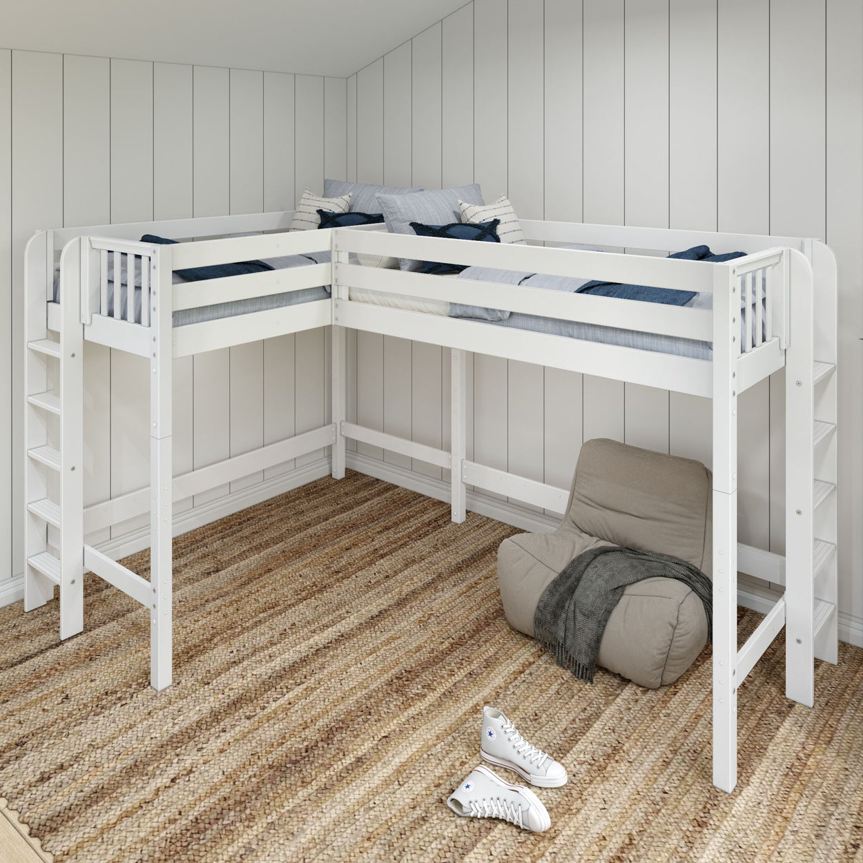 L-shaped white loft bed with cozy blue and white bedding, located above a beige woven rug in a modern bedroom.