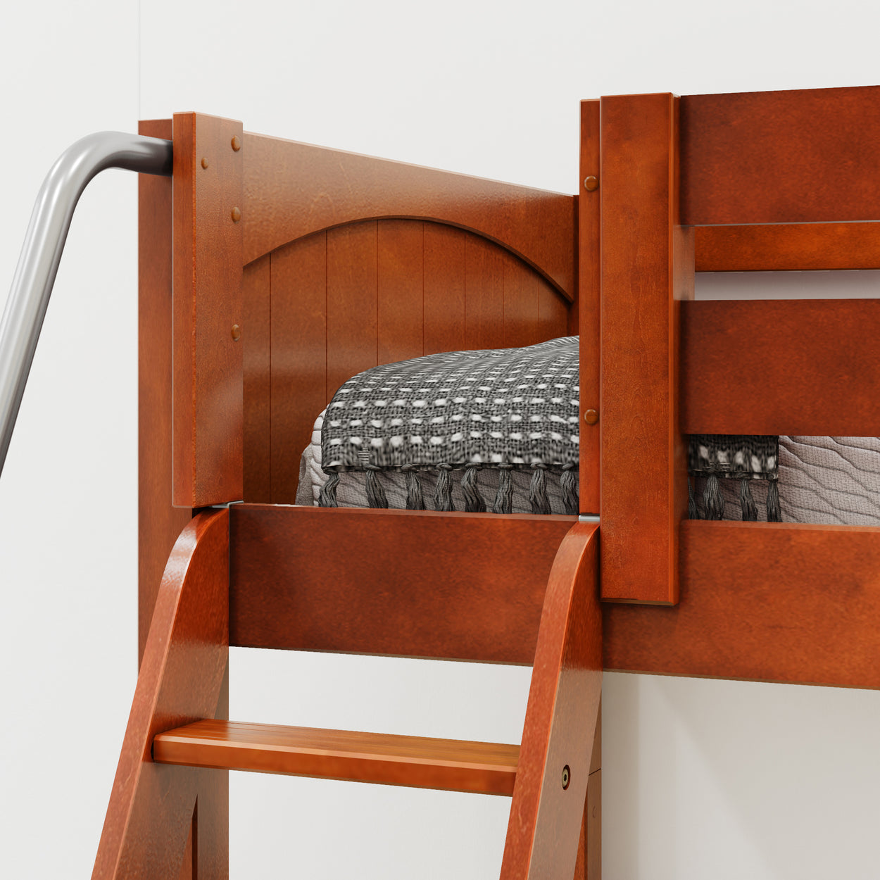 Wooden bunk bed with ladder and patterned blanket.