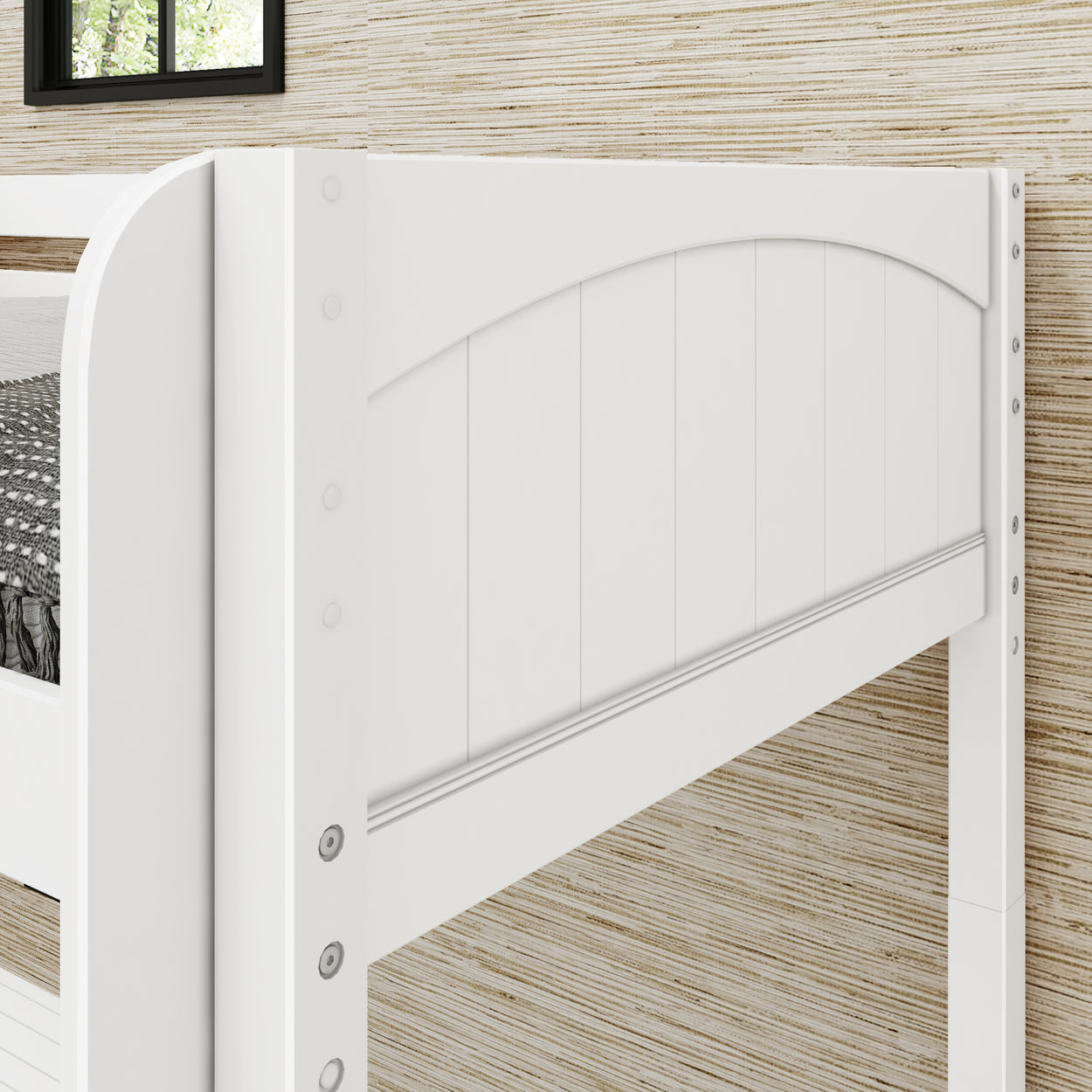 White wooden bunk bed corner with vertical paneling against a striped wall background.