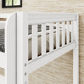 Close-up of white wooden baby crib slatted railing and mattress in a modern nursery with textured wall