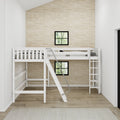 White wooden bunk bed with ladder in a modern neutral kids' bedroom with textured beige grasscloth wallpaper, black-framed windows and hardwood floor