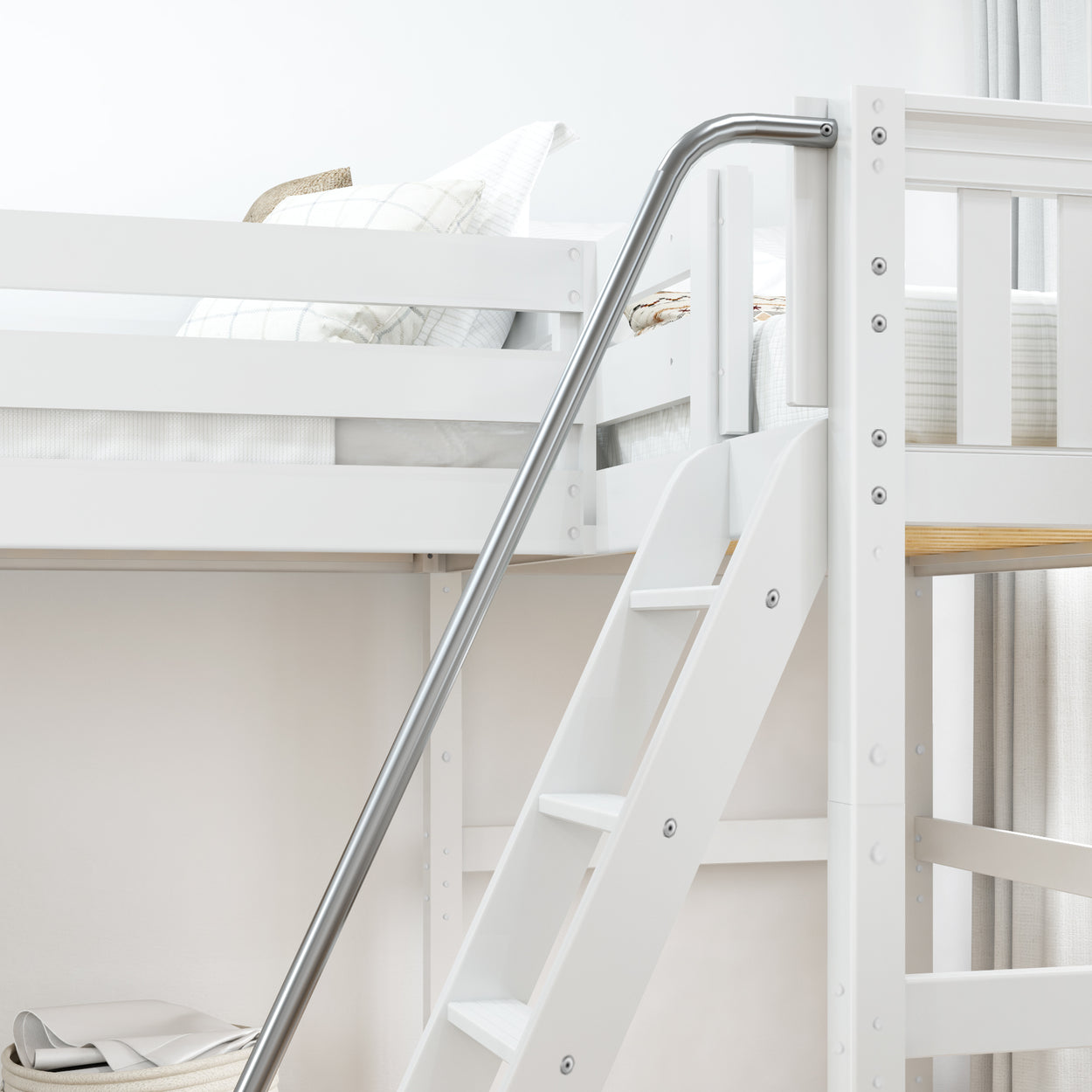 White bunk bed with safety rail and ladder in a modern bedroom setting.