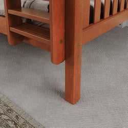 Wooden bunk bed ladder close-up on gray carpet flooring in bedroom.