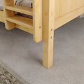 Bunk bed ladder on beige carpet with wooden frame.