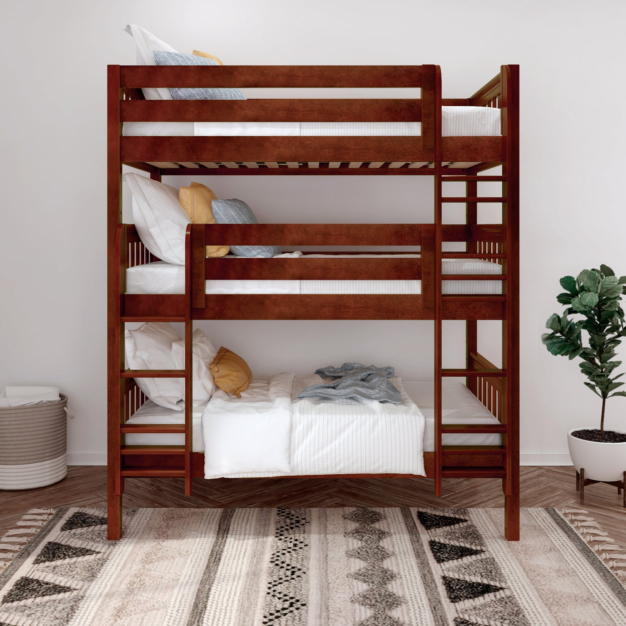 Triple wooden bunk bed with white bedding and pillows in modern bedroom, featuring a decorative plant and patterned rug.