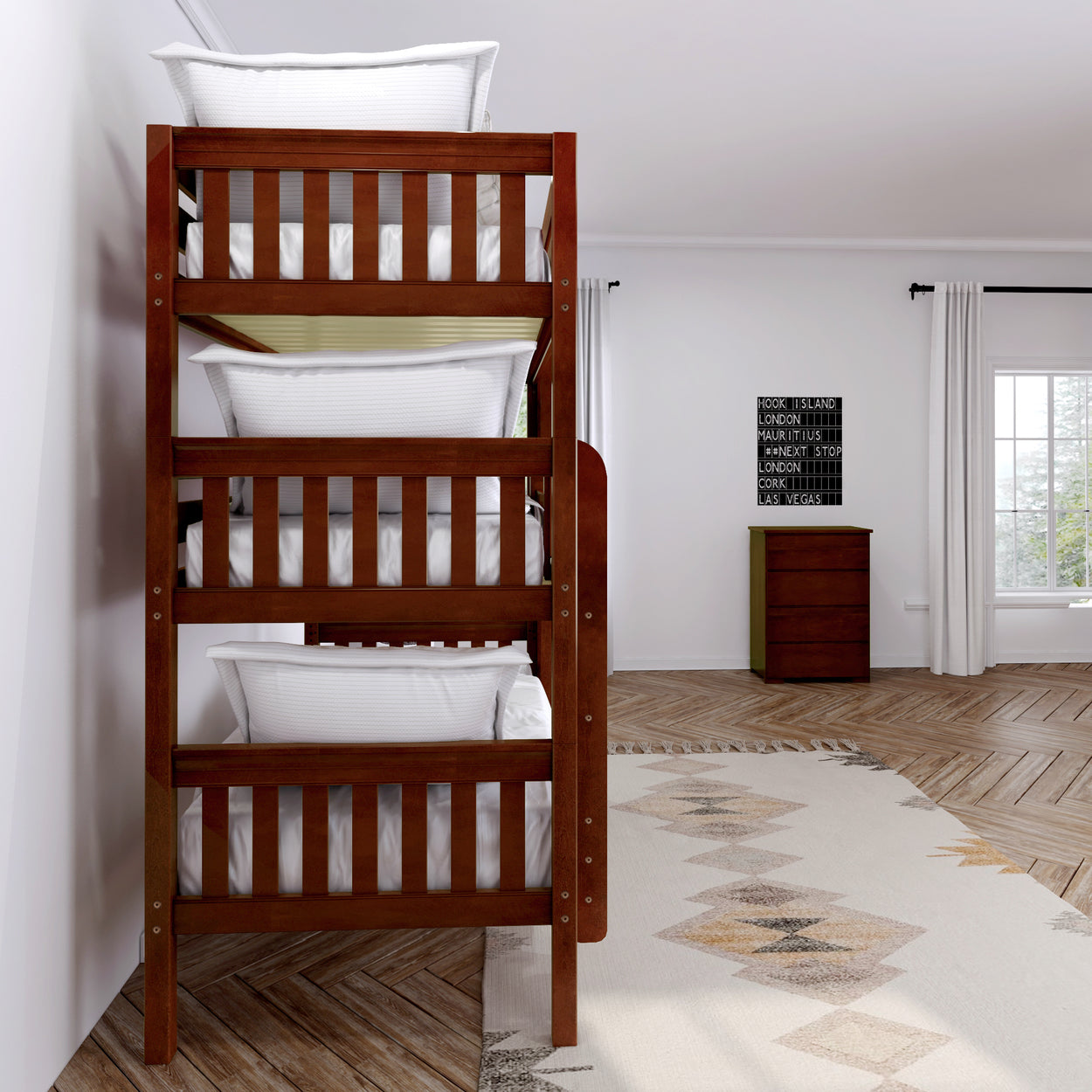 Triple bunk bed in a modern bedroom with natural light and wooden furniture.