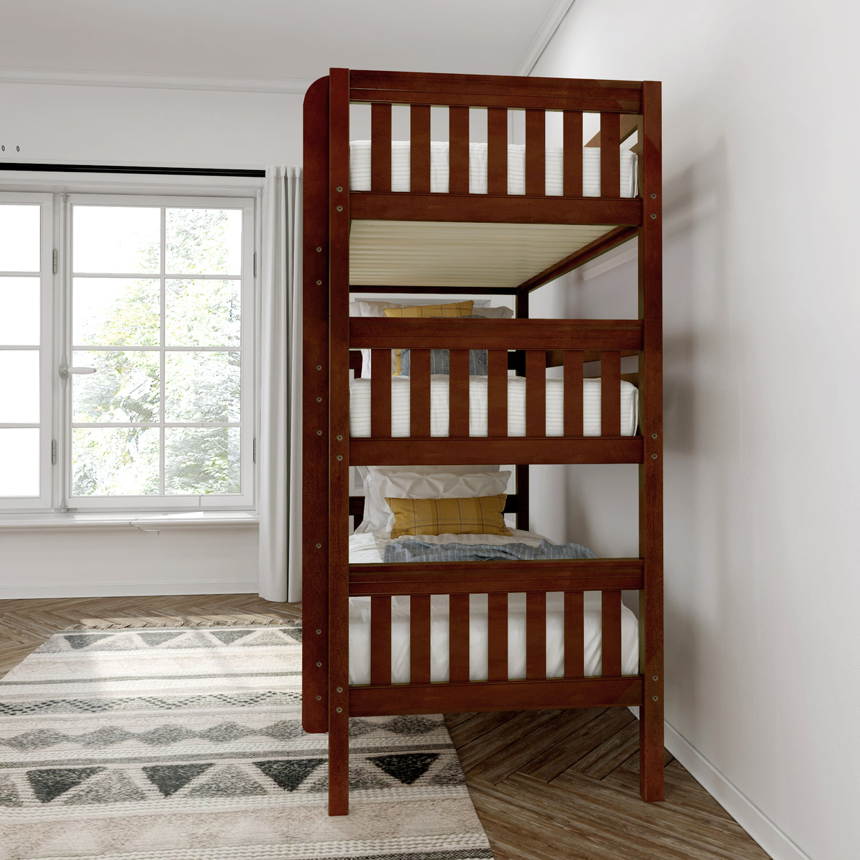 Wooden triple bunk bed in a bright room with large window and patterned rug.