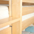 Close-up of light maple bunk bed frame showing wooden slats, vertical support post and mattress edge, solid wood children's bed detail