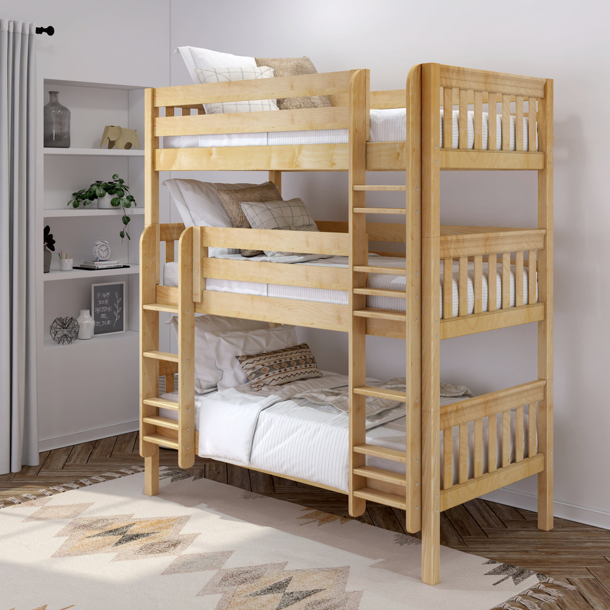 Triple wooden bunk bed in a modern bedroom setting with white bedding and decorative pillows.