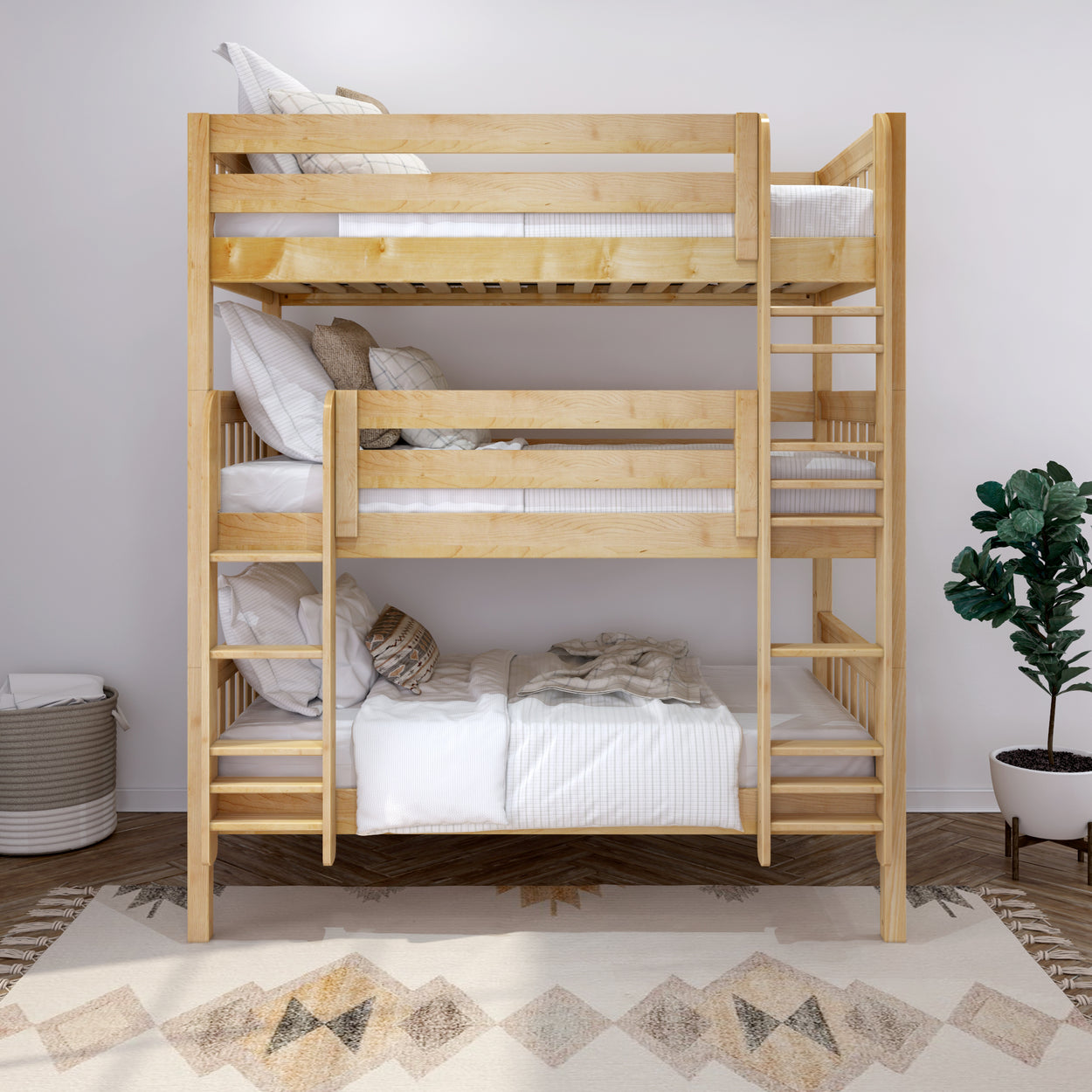 Three-tier wooden bunk bed with comfortable bedding and decorative pillows in a modern bedroom setting.