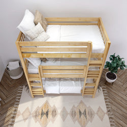 Wooden bunk bed with white bedding in a stylish bedroom with a plant and geometric rug.