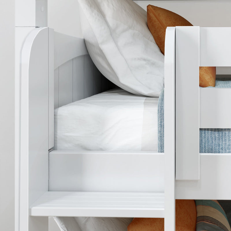 Close-up of white wooden bunk bed with white bedding, orange accent pillows and blue striped mattress in a modern kids' bedroom