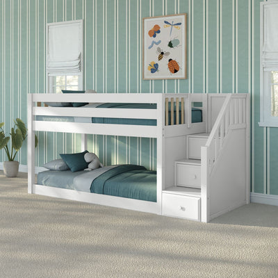 White wooden bunk bed with stairs and built-in storage in a teal striped kids' bedroom with teal bedding, framed insect wall art and potted plant