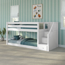White wooden twin-over-twin bunk bed with built-in staircase and storage drawers, teal bedding in children's bedroom with teal striped wallpaper